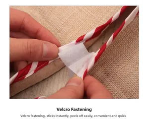 Close-up of red and white striped Christmas tree skirt with velcro closure detail