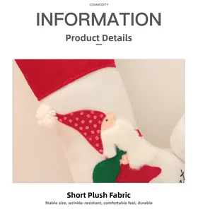Close-up of soft white short plush fabric with festive red polka dot Santa embroidery