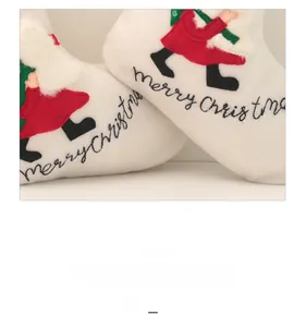 Detail of Christmas stocking with Merry Christmas embroidery and soft faux fur trim edge