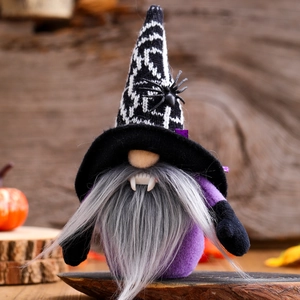 Halloween vampire gnome plush with spider hat and fangs on a rustic wooden background