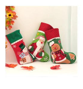 Detail showing high-quality embroidered Santa, Snowman, and Gingerbread man Christmas stockings