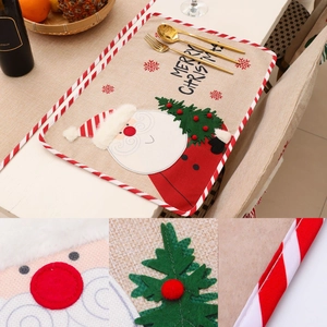 Christmas place mat with Santa embroidery and festive table setting decorations
