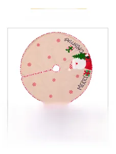 Detailed view of burlap Christmas tree skirt with Santa Claus print and red snowflake patterns