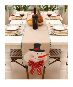 Detailed embroidery of snowman on burlap Christmas table runner with green striped edges