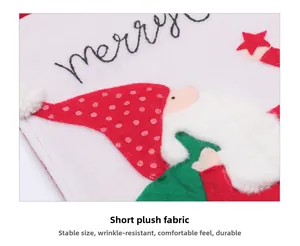 Detail of short plush fabric with towel embroidery Santa and merry lettering