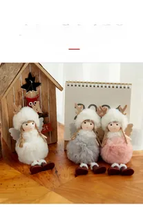Detailed view of three plush reindeer angel hanging ornaments in white, pink, and grey