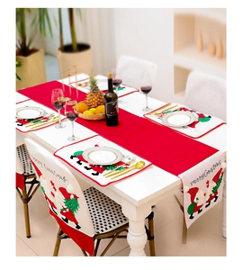 Close-up of Christmas table runner set with Santa Claus embroidery and Merry Christmas text