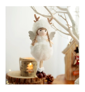 Detail of plush Christmas angel ornament with deer antlers and silver wings in festive setting