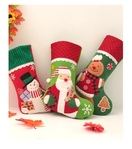 Three embroidered Christmas stockings featuring Santa, snowman, and gingerbread man motifs
