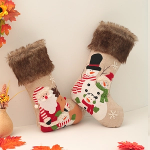 Set of 2 rustic burlap Christmas stockings featuring plush Santa and Snowman embroidery