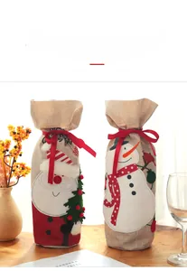 Detailed embroidery of Santa and Snowman on rustic burlap Christmas wine bottle covers