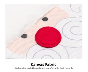Close-up of linen fabric with red felt and plush trim on a Christmas table runner