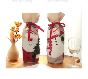 Detailed size view of linen Christmas wine bottle bags with snowman and Santa embroidery