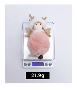 Christmas reindeer angel plush ornament weighing 21.9g on an electronic scale