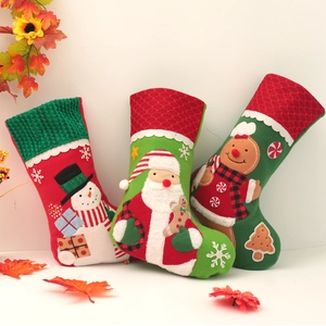 Three embroidered Christmas stockings featuring Santa, snowman, and gingerbread man icons