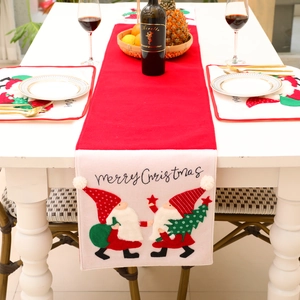 Christmas table runner and placemat set with embroidered gnome and pom-poms decor