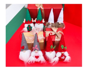 Set of 8 festive Christmas gnome plush ornaments with snowy patterns and holiday details