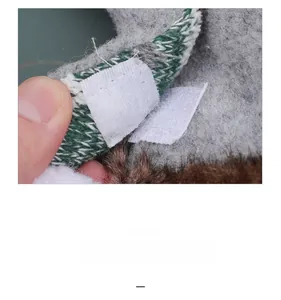 Close-up of Christmas gnome curtain buckle showing green knit fabric and velcro closure