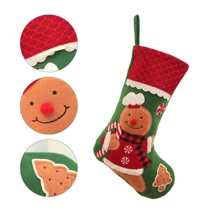 Green Christmas stocking with gingerbread man embroidery and red lace cuff detail