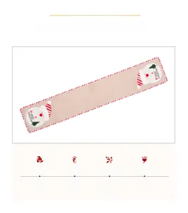 Detail of Christmas burlap table runner featuring Santa Claus and Merry Christmas embroidery