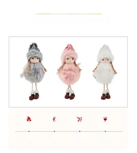 Detailed view of three plush angel Christmas ornaments in white, pink, and grey