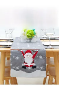 Detailed embroidery of Santa Claus on grey linen Christmas table runner with snowflake prints