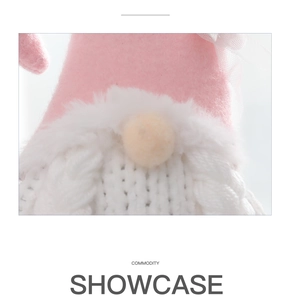 Macro detail of a knit Valentine's gnome featuring mesh decor and a long plush beard