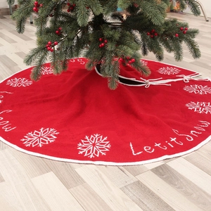 Red knit Christmas tree skirt with white snowflakes and Let it snow holiday embroidery
