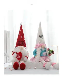 Detail view of Valentine Gnomes plush dolls with XOXO heart and soft pink striped dress