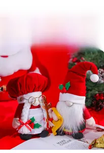 Detail of Christmas gnomes featuring a chef gnome with glasses and traditional red gnome
