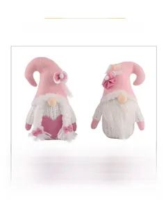 Detail of pink and white Valentine's Day gnomes featuring braided hair and heart decor