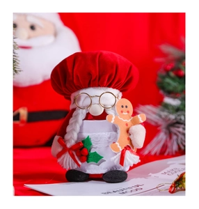 Detailed view of a Christmas gnome doll with golden glasses and a gingerbread man