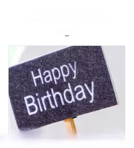 Detail of purple felt Happy Birthday sign with sturdy wooden stick for gnome doll decoration