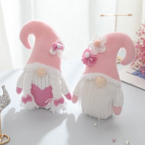 Pink and white knitted Valentine gnomes with hearts and flowers for romantic home decor
