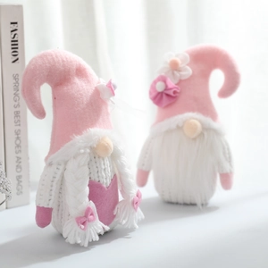 Set of two Valentine knitted flower gnomes in pink and white for holiday decoration