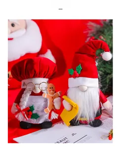 Close-up of Christmas gnome dolls set featuring red outfits and holiday decorations