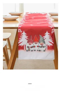 Detail view of a red Christmas table runner featuring festive gnomes and snowflake patterns