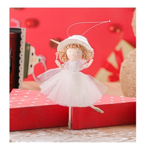 Close-up of a Christmas angel doll in a white lace dress with a hat and gold hair ornament