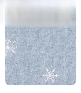 Close-up of light blue fabric texture with white snowflake patterns for chair covers