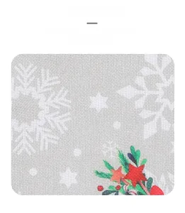 Detailed close-up showing woven gray fabric with white snowflakes and festive stars