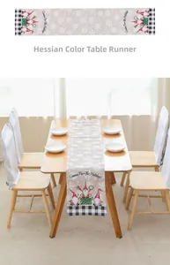 Detail of linen Christmas table runner featuring Gnomes and snowflake patterns on wood