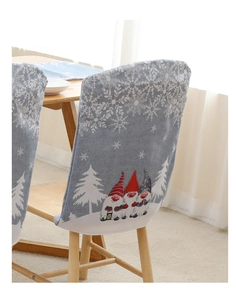 Detail showing grey Christmas chair covers with gnome patterns and white snowflakes decor