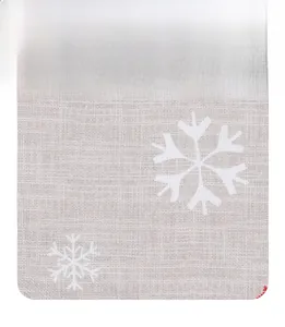 Detail of the high-quality faux linen fabric texture featuring festive snowflake patterns