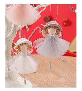 Detail showing plush Christmas angel doll ornaments with lace skirts on a tree