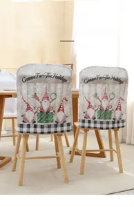 Detail of Christmas gnome chair covers featuring classic Rudolph motifs and plaid patterns