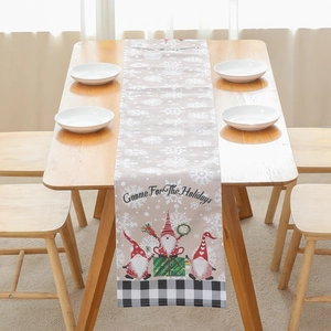 Linen Christmas table runner featuring festive gnomes and Gnome For The Holidays text
