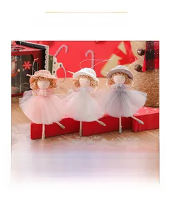 Detailed view of three Christmas angel doll ornaments in pink, white, and grey tulle skirts