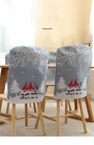 Close-up of light blue Christmas chair cover and table runner with reindeer print