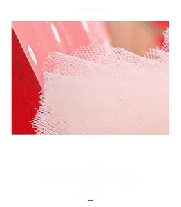 Close-up of pink lace mesh fabric detail on Christmas bunny doll decoration
