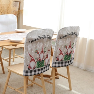 Festive Christmas Gnome chair covers with snowflake patterns and buffalo plaid trim